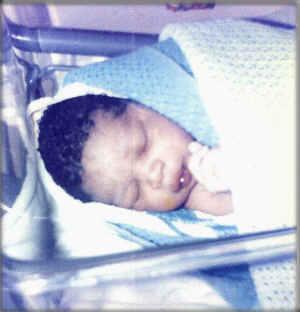 cliff19.jpg - I was born in London England in a hospital called Alexandra Hospital. My birth was a very successful one with no complications and my mom told me that when I came out I cried really hard with my mouth wide open like no other baby before me. I was a very good baby that didn't cause any trouble for most of my first years.  I slept throughout the day without a care in the world and I ate whatever food I was given. I wasn't a picky eater. Quite simply my mom said I was the best baby ever. My mom braided my hair when I was an infant and people used to think that 1 was a girl, and my mom always had to tell people I wasn't.